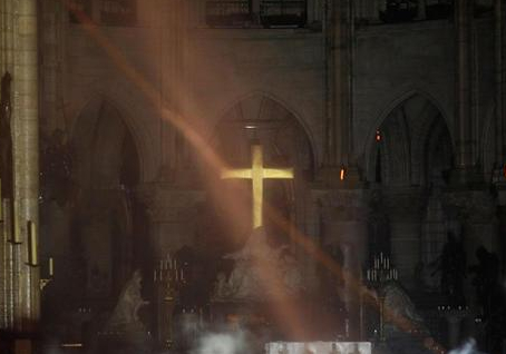 https://www.cbsnews.com/news/notre-dame-cathedral-on-fire-crucifix-altar-cross-paris/